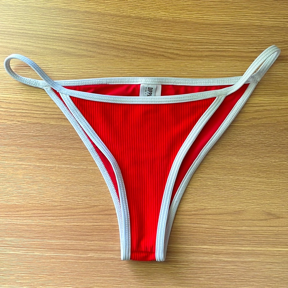 Dippin’ Daisy’s red ribbed bathing suit bottom with white lining